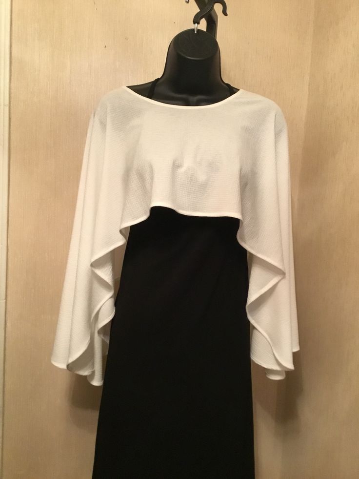 lightweight slightly textured whit polyester free flowing overlay. Perfect for pairing with your favorite sleeveless garment. Delicate care Elegant Cape Top For Spring, Elegant Spring Cape Top, Free Flowing, Bell Sleeve Top, Ruffle Blouse, White, Women's Top