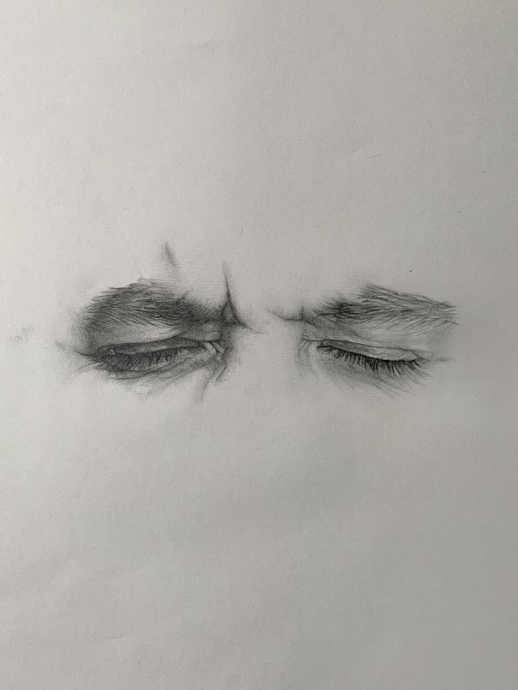 an eye with long lashes is shown in this black and white photo, which appears to be drawn on paper