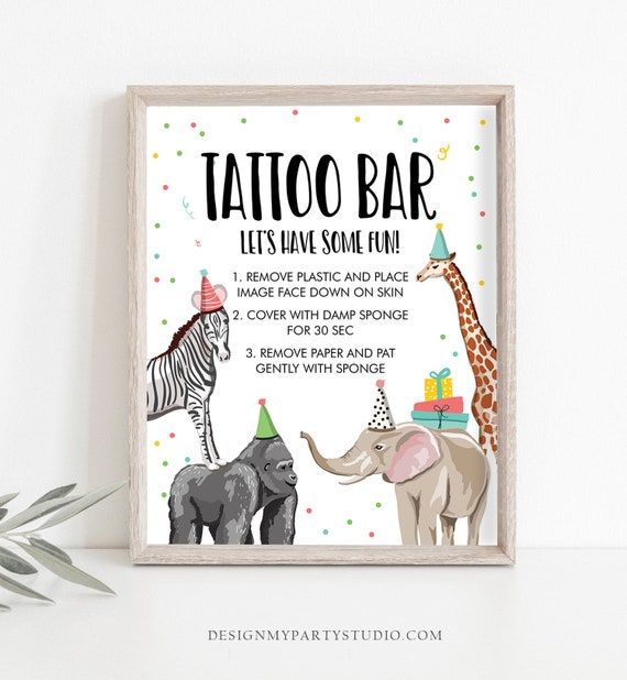 a poster with an elephant, giraffe and zebra on it that says tattoo bar