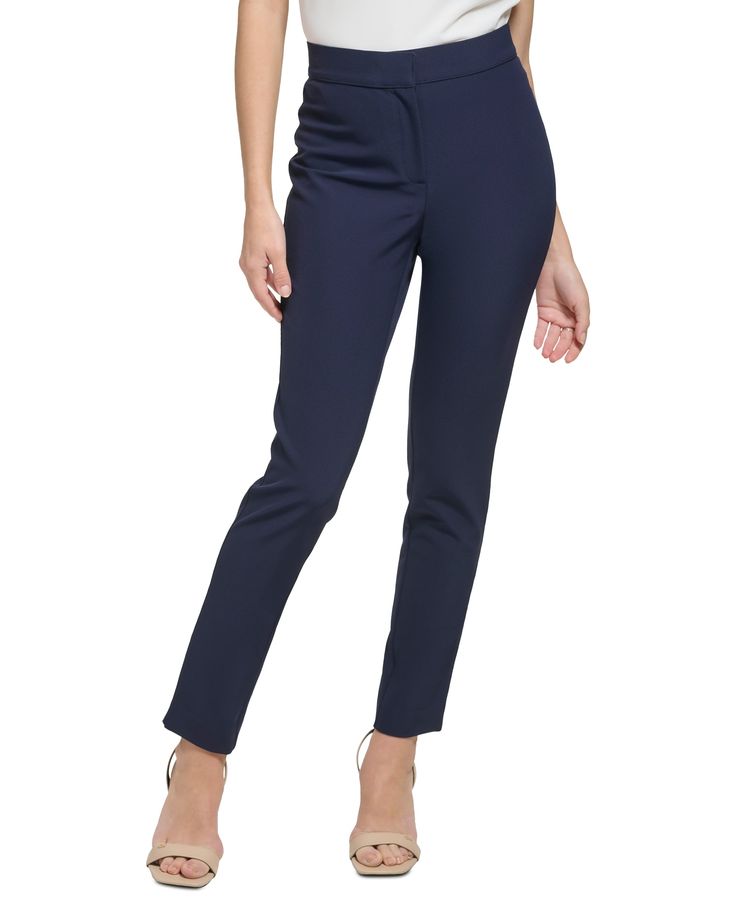 The essential flat-front pants from Calvin Klein feature a skinny fit that skims the body without being too tight. Approx. inseam: 28" Hook-and-bar closure with zipper fly Nylon, spandex Machine wash Imported Modern Fitted Calvin Klein Bottoms, Fitted Mid-rise Elastane Dress Pants, Chic Slim Fit Elastane Dress Pants, Sleek Fitted Dress Pants For Spring, Sleek Fitted Mid-rise Pants, Sleek Mid-rise Fitted Pants, Solid Mid-rise Fitted Dress Pants, Fitted Mid-rise Solid Dress Pants, Slim Fit Elastane Pants With 5-inch Inseam