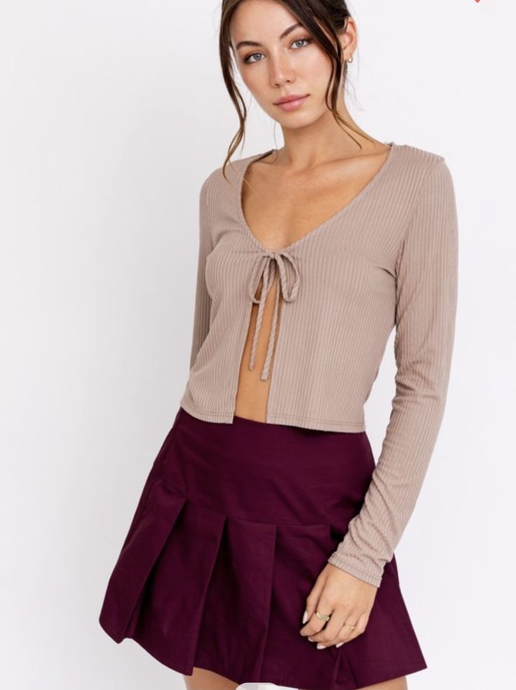 Look on trend with this front tie long sleeve top. A material so soft, It'll be your new go to shirt. Fits the wardrobe all year long, plus we love a good neutral, am I right? Fall Long Sleeve Top For Brunch, Long Sleeve Tops For Winter Date Night, Long Sleeve Tops For Date Night In Winter, Winter Long Sleeve Tops For Date Night, Spring Long Sleeve Tops With Tie Sleeves, Casual Long Sleeve Top With Tie Sleeves, Trendy Fall Loungewear Blouse, Chic Tops With Tie Sleeves For Fall, Chic Tie Sleeve Tops For Fall