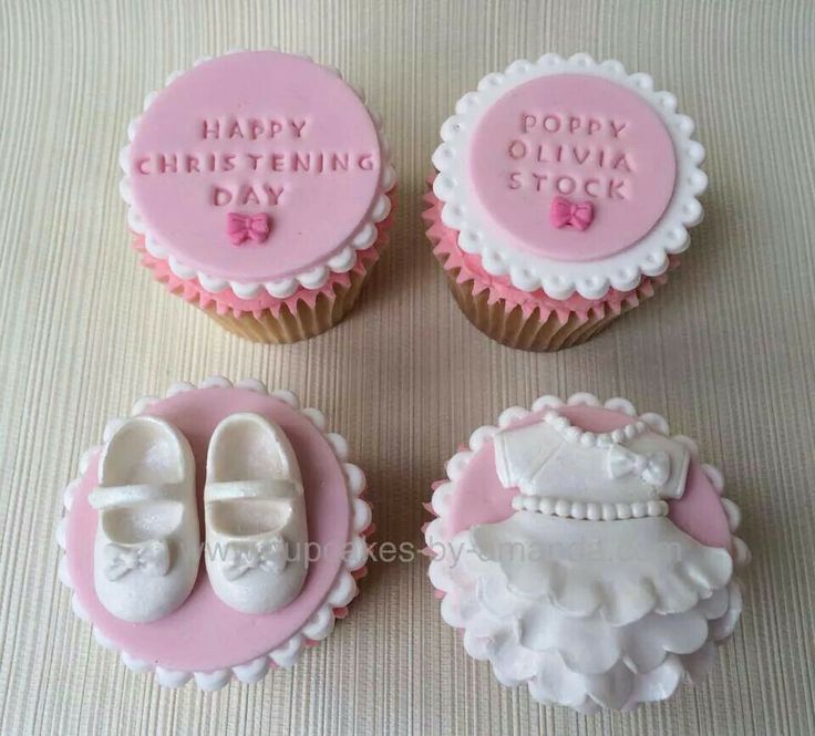 three cupcakes decorated with pink and white icing