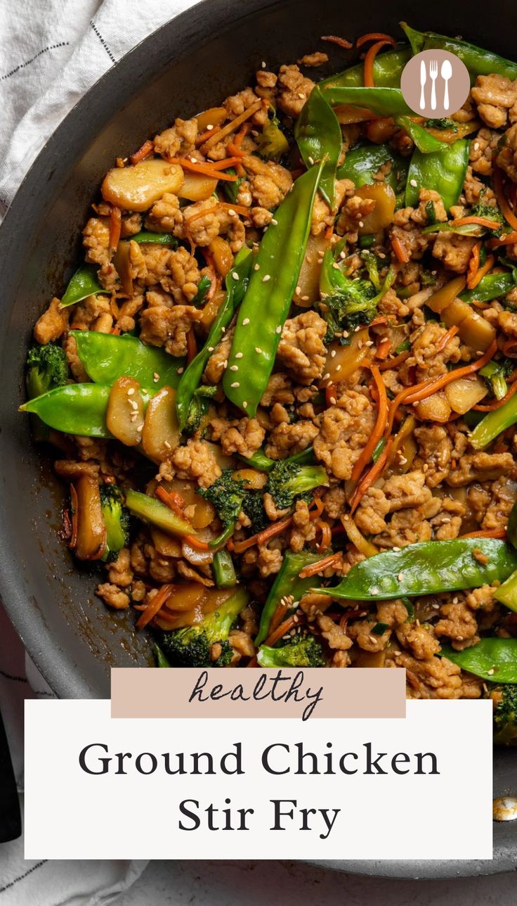 ground chicken stir fry in a skillet with broccoli and carrots on the side