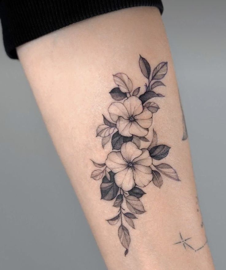 a woman's leg with flowers on it