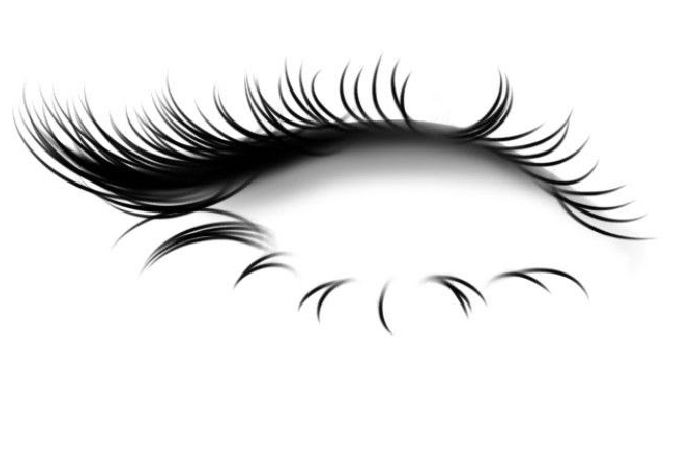 an eye with long eyelashes on white background