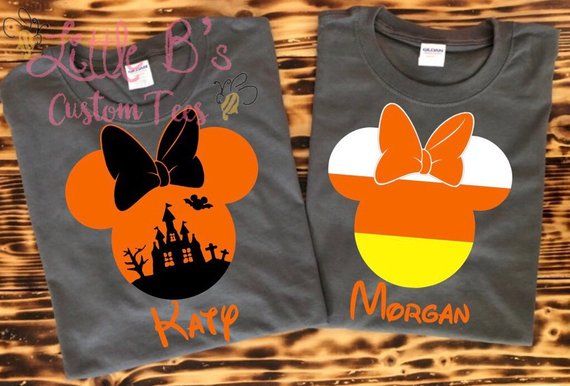 two shirts with mickey mouse ears on them, one is gray and the other is orange