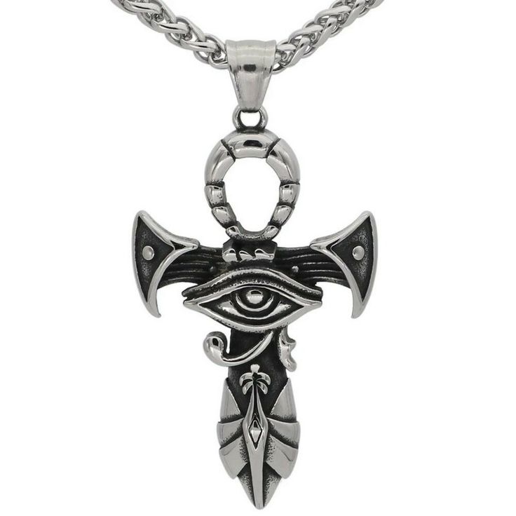 an evil eye pendant on a chain with a silver link and black eyes in the center