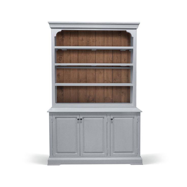 a white bookcase with wooden shelves and doors on the front, against a white background