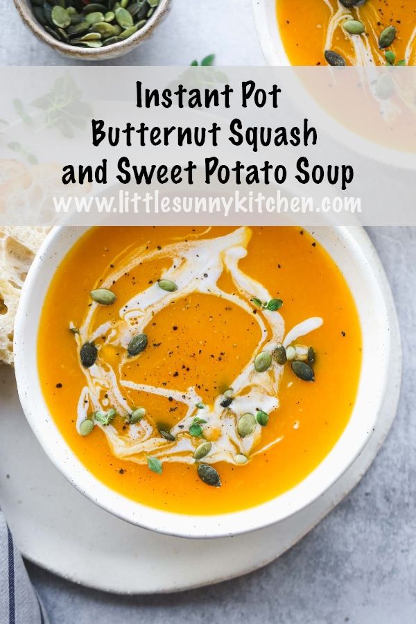 two bowls of butternut squash and sweet potato soup with toasted bread on the side