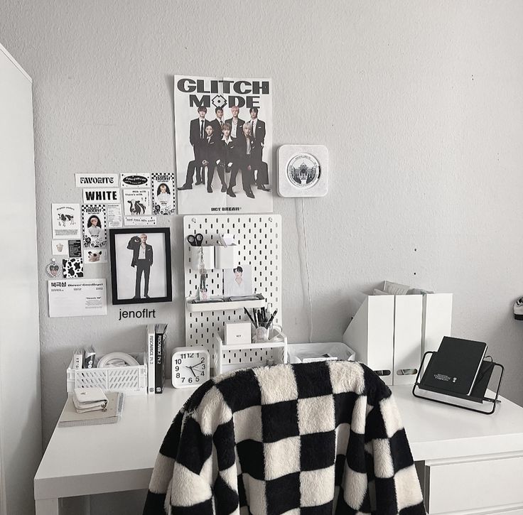 a black and white checkered blanket sitting on top of a desk