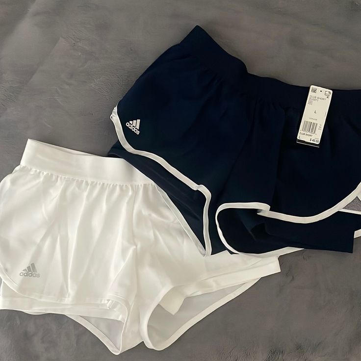 2 Pairs Of Shorts. Never Been Worn. Has A Spandex Layer Underneath. Mid Rise. Wind Breaker Material On Top. 1x White With Navy Detail. 1x Navy With White Detail. Adidas Summer Activewear With Built-in Shorts, Adidas Activewear With Built-in Shorts For Summer, Adidas Stretch Bottoms For Workout, Adidas Workout Bottoms For Summer, Adidas Summer Workout Bottoms, Adidas Stretch Bottoms For Summer, Adidas Stretch Summer Shorts, Stretch Adidas Athletic Shorts, Adidas Stretch Moisture-wicking Shorts