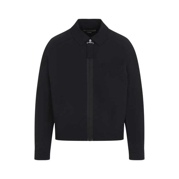 Jacquemus Le Blouson Linu Black Polyamide Jacket. Black tech fabric, pointed collar, front zipper closure with grosgrain puller, patch pocket on the breast, rounded shoulders, long sleeves, button-tabs at the side edges, boxy fit, straight hem.Gender: MenMaterial: 100%POLYAMIDEColor: BlackMade in: TNProduct ID: 245BL013.1531_990*Import tax/duty will be calculated at checkout (If applicable) Classic Track Jacket With Ribbed Cuffs For Work, Business Blazer With Padded Collar, Business Blazer With Padded Collar And Long Sleeves, Modern Track Jacket With Ribbed Cuffs, Modern Long Sleeve Track Jacket With Ribbed Cuffs, Modern Long Sleeve Outerwear With Concealed Placket, Business Outerwear With Ribbed Cuffs And Long Sleeves, Modern Long Sleeve Blazer With Zipper Closure, Long Sleeve Track Jacket With Zipper For Work