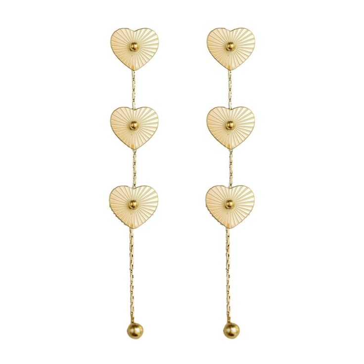 Add a sleek and modern touch to your everyday wardrobe with these on-trend gold plated stainless steel earrings. Featuring three delicate heart charms that swing and sparkle with every movement, these weightless earrings are the perfect easy, seasonless update to pair with both neutrals and prints. Best of all, the 3.5” duster style is basically weightless! ALL ACCESSORIES ARE FINAL SALE! Feel free to email us at info@emersoncharles.com or DM us with any questions regarding fit, styling, or our return policy in general. Elegant Stainless Steel Heart Earrings, Trendy Gold Hypoallergenic Heart Earrings, Tarnish Resistant Metal Heart Drop Earrings, Tarnish Resistant Metal Drop Heart Earrings, Valentine's Day Stainless Steel Heart Earrings, Minimalist Gold Heart Drop Earrings, Heart-shaped Tarnish Resistant Stainless Steel Earrings, Heart-shaped Stainless Steel Tarnish Resistant Earrings, Heart-shaped Stainless Steel Tarnish-resistant Earrings