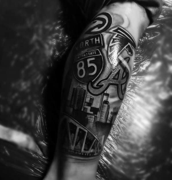 black and white photo of a man's arm with the number thirty six on it