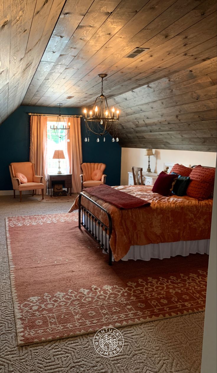 a bed sitting in the middle of a bedroom next to a window