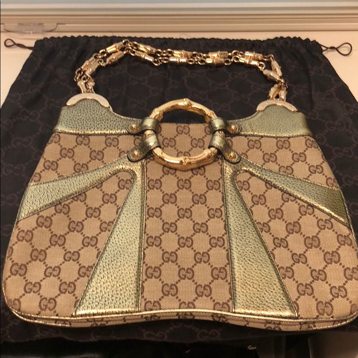 Beautiful New Condition Gucci Bag. Was Worn Once. Has No Stains, Rips, Or Defects. Clean From The Inside Out. Designer Pre-owned Shoulder Bag, Designer Gold Bags With Double Handle, Designer Gold Double Handle Bag, Designer Pre-owned Rectangular Shoulder Bag, Designer Pre-owned Shoulder Bag With Double Handle, Designer Pre-owned Double Handle Shoulder Bag, Luxury Gold Bag With Horsebit Detail, Designer Gold Satchel Shoulder Bag, Luxury Gold Bags With Horsebit Detail