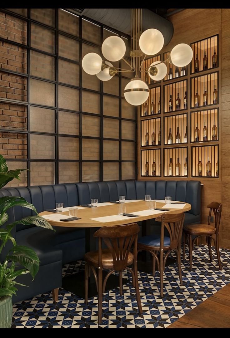 a dining room with blue booths and wooden tables