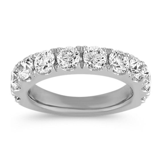 a white gold wedding band with five round cut diamonds on the top and bottom half