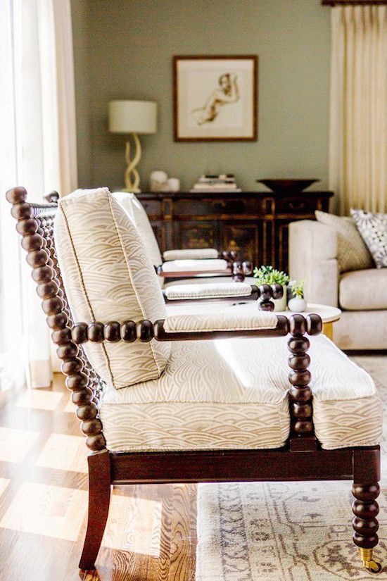 a living room filled with furniture and a large window