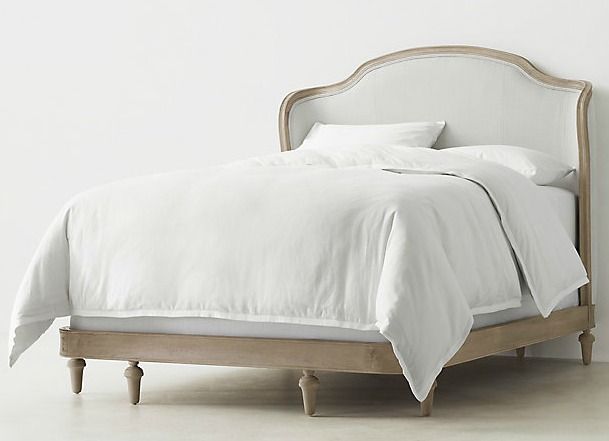 a bed with white linens and pillows in a minimalistic bedroom setting that is clean and ready to be used as a headboard