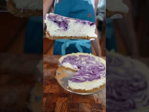 there is a cake with purple icing on the top and one has a slice taken out