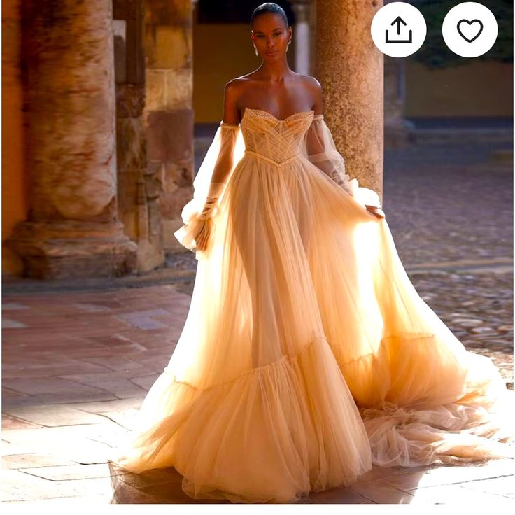 a woman in an off the shoulder dress is standing outside