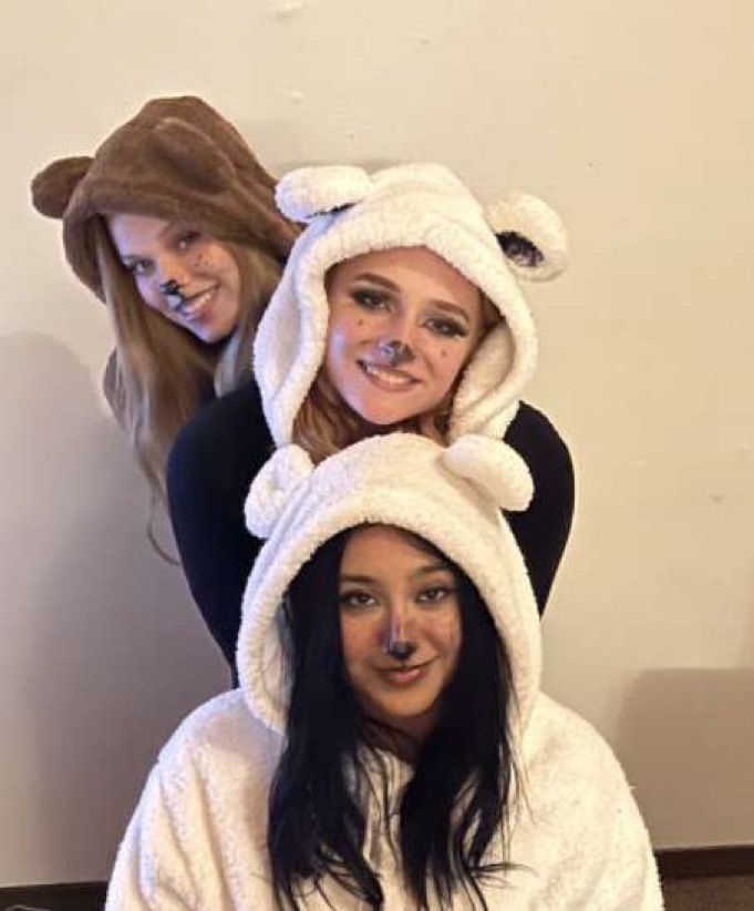 two girls in animal costumes posing for the camera