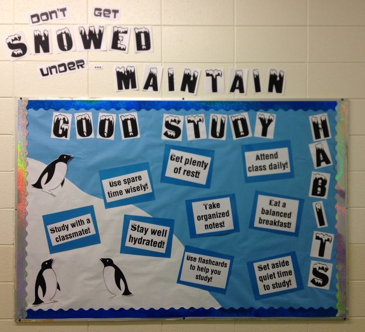 a bulletin board with penguins and words on it