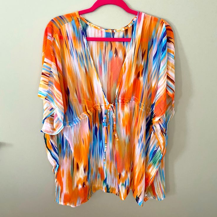 This Beach Cover-Up Is Brand New, Never Been Worn Or Washed. I Received As A Gift, It’s Beautiful But I Have Something Very Similar. It’s “One Size“ Fits All. The Colors Are Vibrant And Beautiful! No Tags Or Ever Attached. It Was Purchased Online. Bundle With Other Items In My Closet For Huge Savings! Casual Multicolor V-neck Cover-up, Orange V-neck Cover-up For Spring, Multicolor Beach Cover-up Tops For Vacation, Beachy Orange Cover-up For Vacation, Multicolor Beachy Cover-up For Day Out, Orange Summer Cover-up For Beach Season, Summer Orange Beach Cover-up, Orange Summer Vacation Cover-up, Orange Summer Beach Season Cover-up