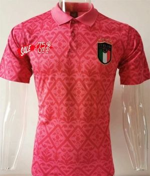 a pink polo shirt with an emblem on the chest