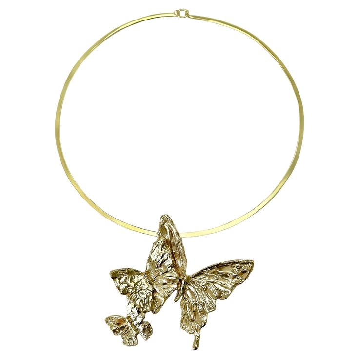 Intention: Take Flight Design: Three hand carved butterflies float effortlessly from a sleek brass collar. Style Suggestion: Comfortably cool against your skin, this necklace pairs perfectly with a plunging neckline Particulars: thai gold brass collar is 5 5/8" length, 5 1/4" width pendant is 2 3/4" length, 3 1/4" width Handcrafted in the USA. Gold Butterfly-shaped Brass Jewelry, Gold Butterfly Shaped Brass Jewelry, Gold Metal Jewelry With Butterfly Clasp, Gold Metal Butterfly Necklace For Party, Elegant Gold Butterfly Metal Necklace, Flight Design, Gold Brass, Plunging Neckline, Collar Style