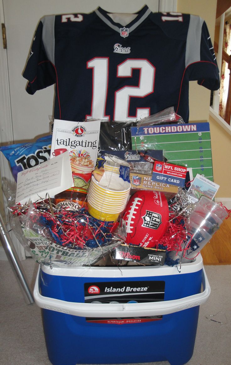 a football jersey sitting on top of a cooler filled with candy and candies in it