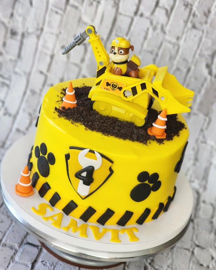 a birthday cake with a construction theme on it