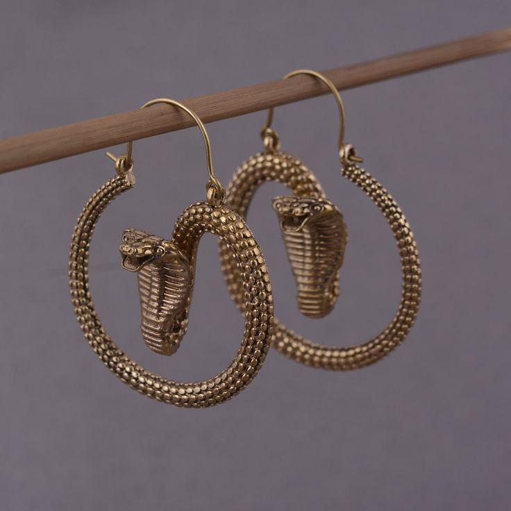 Snake gold  Earring Handmade PRODUCT CODE:-   HA1  Material:- Brass ♥We Crafted These in 100% Brass These Simple Earrings are perfect for any occasion. Then we lightly hammered and slightly polished to keep a matte finish~ Make a Statement with these minimal yet simple Unique Earrings. ♥Please make sure to include the correct address before ordering. You can return an item within 10 days after successful delivery. We offer a 100% Money back guarantee if you are not satisfied with your purchase ♥Thank you for visiting my shop! if you have any questions please send me a message. I give you a quick reply so don't hesitate to ask questions, I am 24 hours here Don't miss the rest of the collection, click the link below! https://www.etsy.com/in-en/shop/jaipurjewelryIN? if you have no PayPal, ple Handmade Gold Snake-shaped Earrings, Bronze Snake Shape Jewelry As Gift, Bronze Snake-shaped Jewelry Gift, Adjustable Hammered 14k Gold Earrings, Hammered Yellow Gold Dangle Hoop Earrings, Tarnish Resistant Yellow Gold Brass Earrings, Yellow Gold Dangle Hoop Earrings With Hammered Texture, Yellow Gold Hammered Dangle Hoop Earrings, Traditional Hammered Gold Jewelry