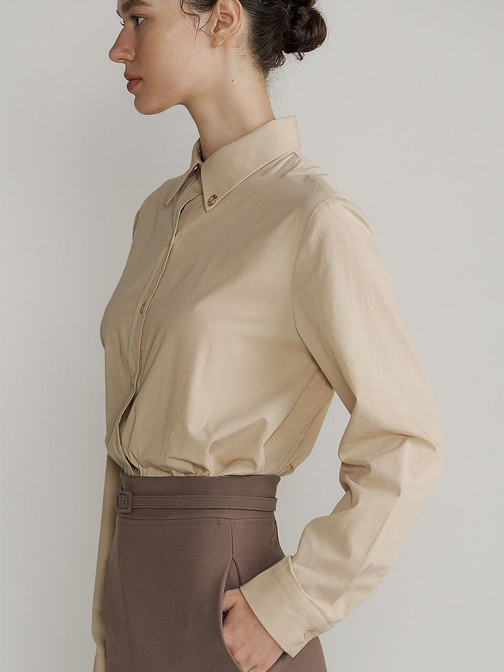 Editor's notesCut from soft cotton blend fabric, this standard fit shirt features classic silhouette with collar design and button fastenings. It is accentuated with gold metal detail at collar. - Cotton and rayon blend shirt- Natural, standard silhouette- Luxurious, refined mood- Versatile styling and easy layeringMeasurements(in.)Size One Size(XS-M)- Length: 25.59 in - Shoulder: 16.54 in - Bust: 22.05 in - Waist: 21.65 in - Sleeve length: 24.41 in - Sleeve width: 7.09 in * Model info: Height 5' 10 Bust 31.5 Waist 23.5 Hip 35.5Composition & Care- 65% Rayon, 35% Cotton - Dry Cleaning Designer- by Lucirzu Classic Long Sleeve Neutral Shirt, Timeless Spread Collar Tops For Office Wear, Beige Work Shirt With Concealed Placket, Beige Workwear Shirt With Concealed Placket, Timeless Office Wear Tops With Spread Collar, Classic Neutral Workwear Shirt, Classic Neutral Shirt For Workwear, Classic Neutral Shirt For Work, Beige Shirt With Concealed Placket For Work