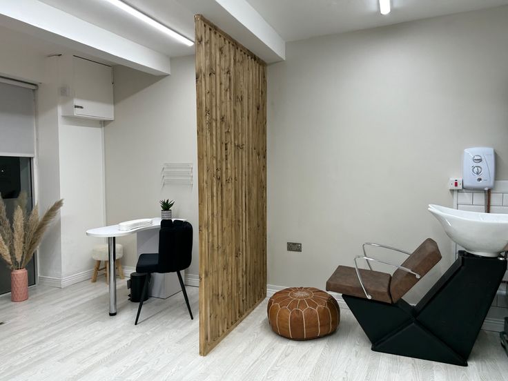 a room with white walls and wood accents