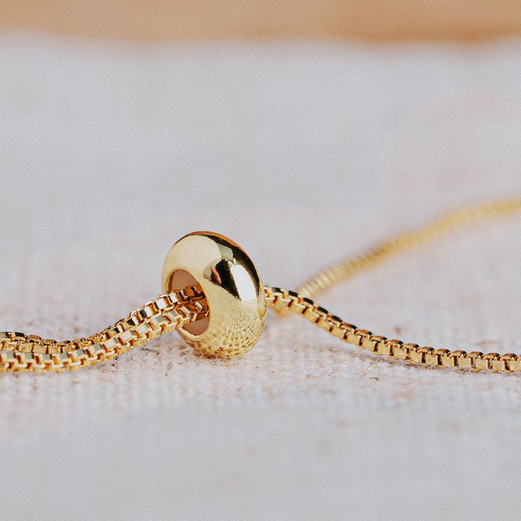 Treehut's Lyla collection features a raw quartz druzy stone in a modern hexagon shape on an adjustable chain bracelet. Understated and refined, this golden bracelet adds just a hint of eye-catching shine to your look. Wear it solo for a minimalist statement or stack it with similar styles for a lovely, layered look. Druzy is known as 'The stone of star dust or fairy dust' it refers to tiny dust of diamond-like crystal scattered on the face of the gemstone. It is believed to have magical and myst Minimalist Yellow Gold Resizable Bracelets, Minimalist Resizable Yellow Gold Bracelets, Gold Charm Bracelet With Adjustable Length, Minimalist Box Chain Jewelry For Jewelry Making, Gold Charm Bracelet With Adjustable Length As Gift, Minimalist Charm Bracelet With Adjustable Chain Gift, Adjustable Yellow Gold Round Pendant Jewelry, Adjustable Box Chain And Snake Chain Bracelets, Minimalist Adjustable Charm Bracelet Gift