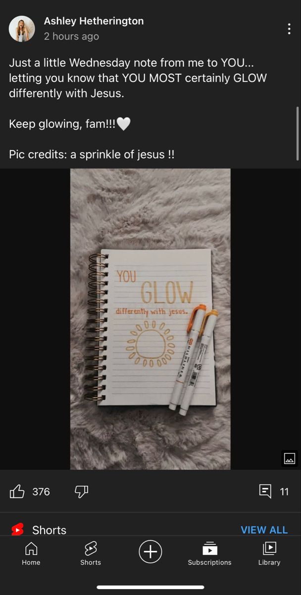 a notepad and pen sitting next to each other on top of a bed with the words, you glow written on it