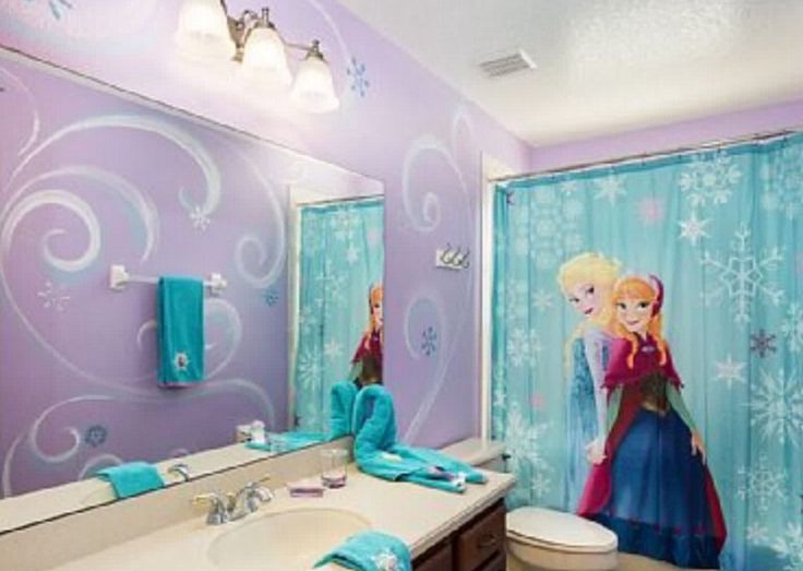 a bathroom decorated in blue and purple with frozen princess shower curtain