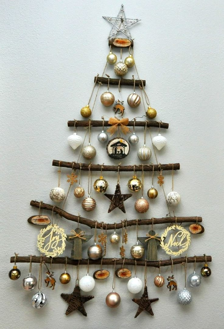 a christmas tree made out of branches and ornaments