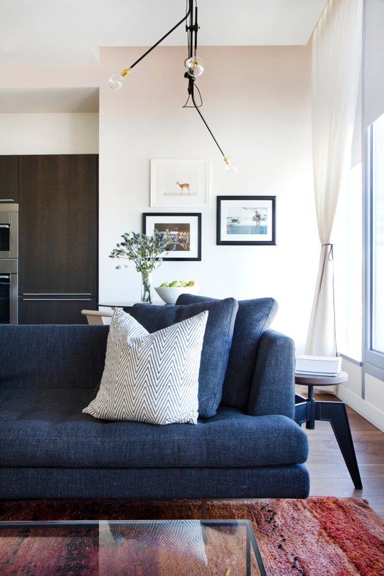 a living room filled with furniture and decor