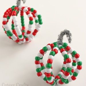 two christmas ornaments made out of beads on a white background with the words pony bead christmas ornaments