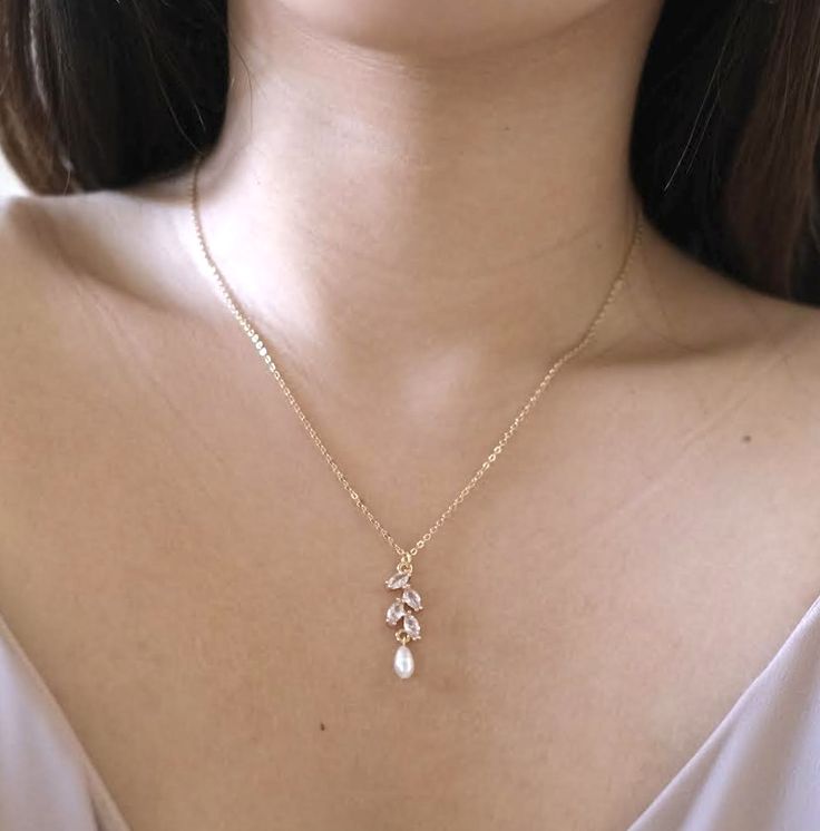 14k gold-filled cz floral petal drop necklace #formalwear #formalnecklace #goldnecklaceset #goldnecklace #pearlnecklace #pearlgoldnecklace #goldpearlnecklace #bridalnecklace #weddingnecklace #jewelry #necklaceoftheday #necklaceshop #necklace #necklacepearl #necklaceforbride #bridenecklace #cubiczirconia #bridesmaidjewelry #bridesmaidnecklace #bridaljewellery #wedding Delicate Gold Bridal Necklace With Clavicle Chain, 14k Gold Pearl Pendant Necklace For Wedding, Yellow Gold Delicate Chain Jewelry For Wedding, Gold Bridal Necklace With Delicate Chain For Anniversary, Yellow Gold Necklace With Delicate Chain For Wedding, 14k Gold Delicate Chain Pearl Necklace For Weddings, Delicate Gold Bridal Necklace With Pearl Pendant, Yellow Gold Bridal Necklace With Pearl Pendant For Wedding, 14k Gold Necklace With Pearl Pendant For Wedding