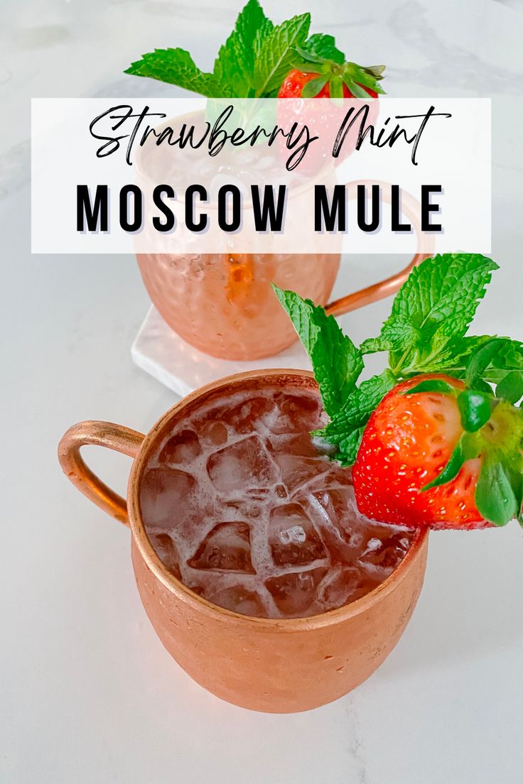 two moscow mules with strawberries and mint garnish in copper mugs