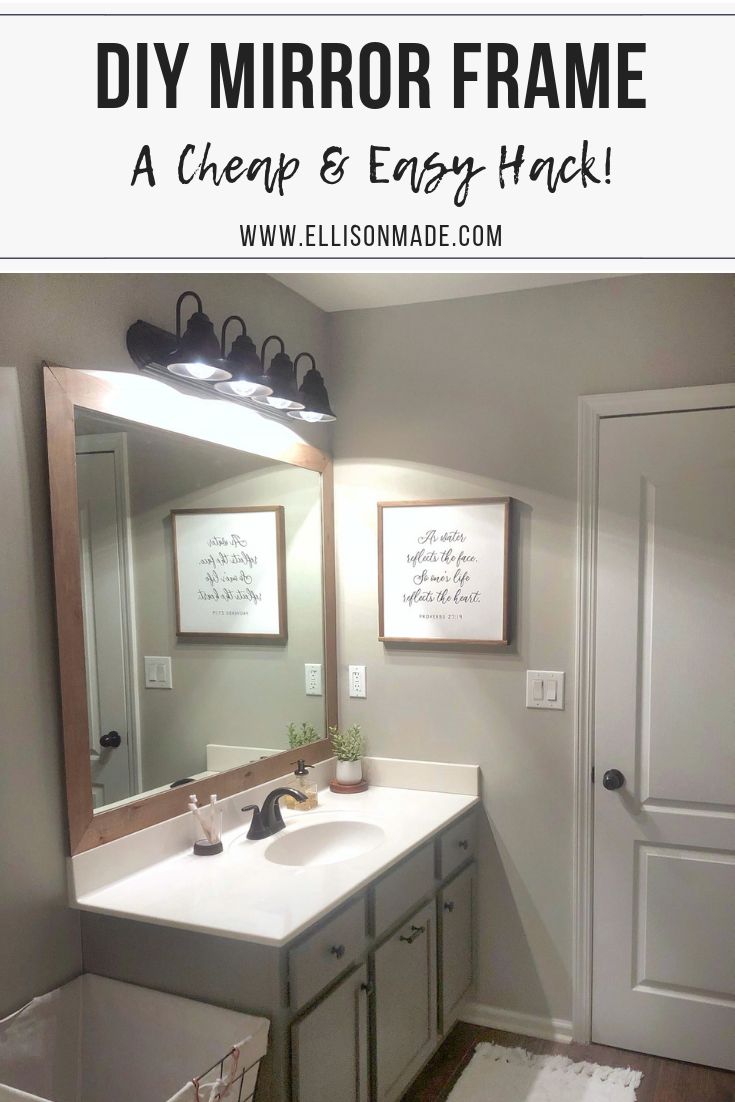 a bathroom with a large mirror over the sink