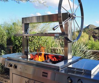 an outdoor bbq grill with fire burning in it