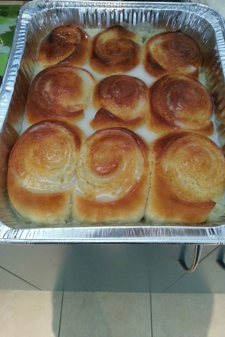 a pan filled with rolls sitting on top of a counter