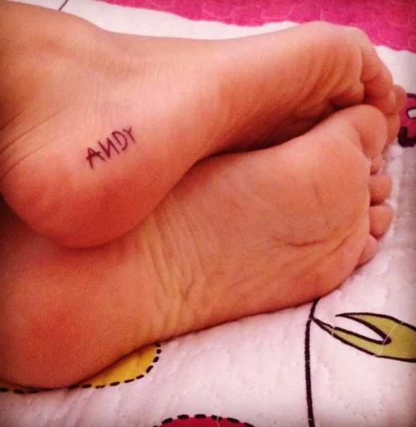 someone has written the word andy on their foot and it's in front of them