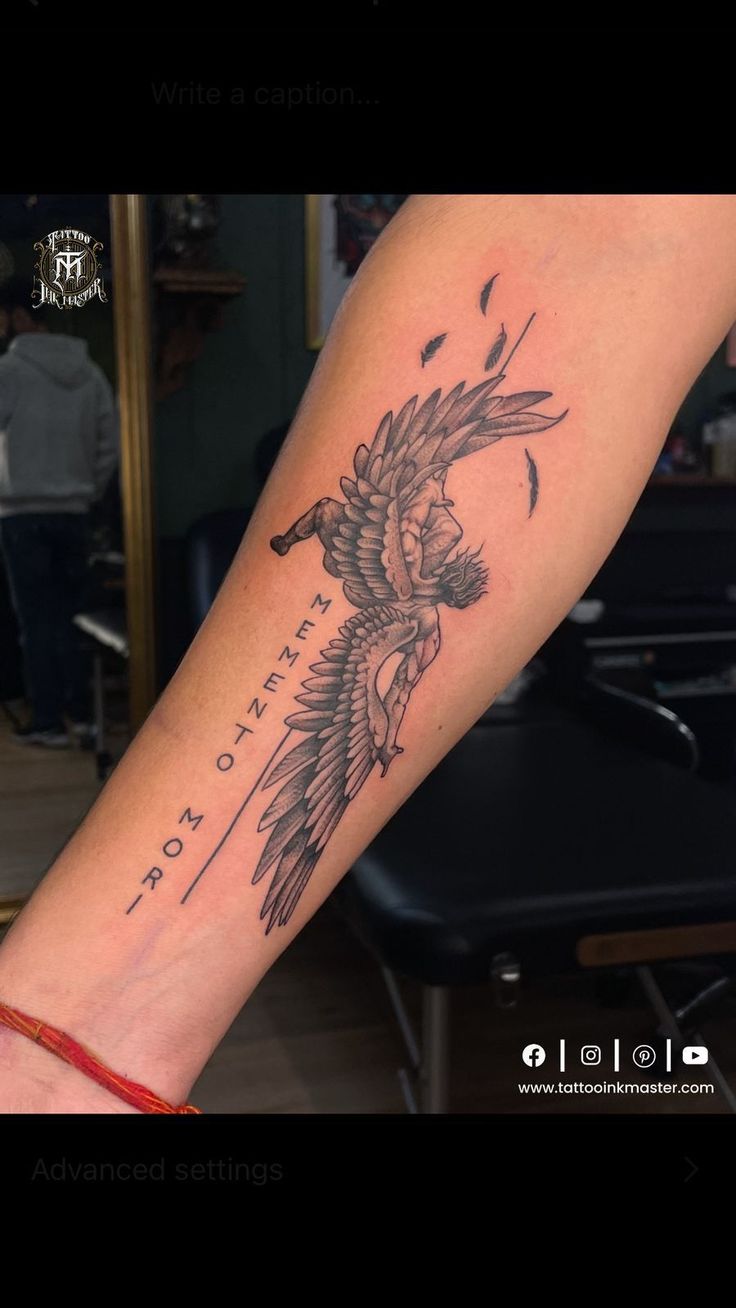 a person with a tattoo on their arm that has a bird in the middle of it