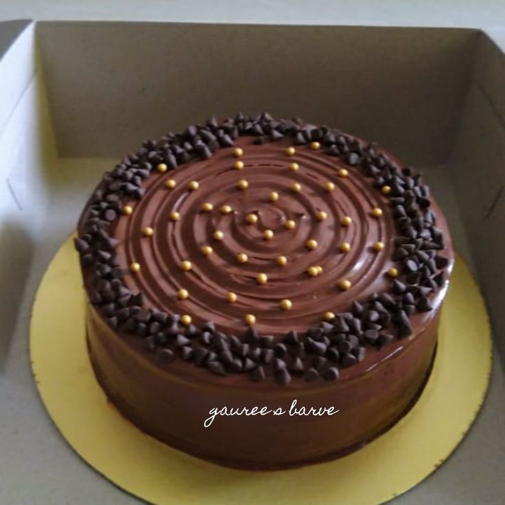 a chocolate cake sitting in a box on top of a table